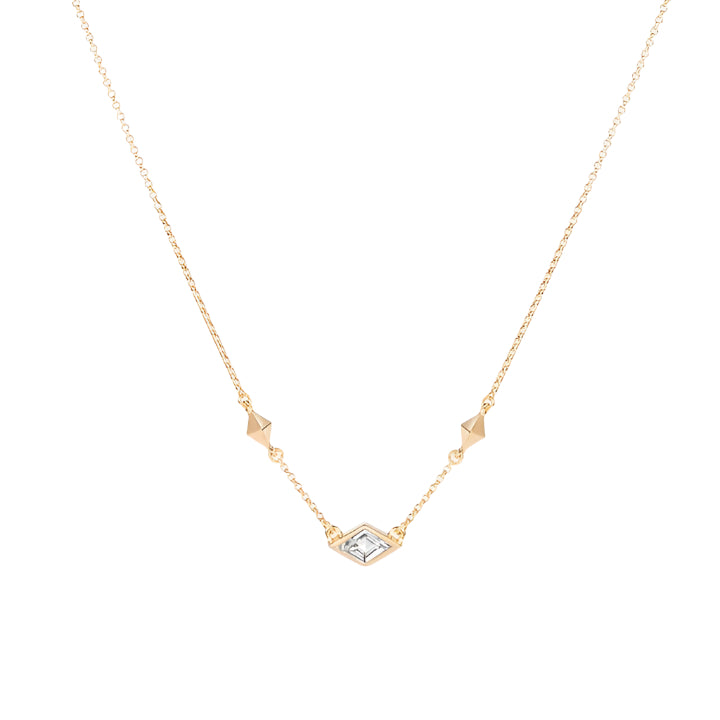 A gold vermeil necklace with a white topaz gemstone, featuring a delicate chain and geometric design.