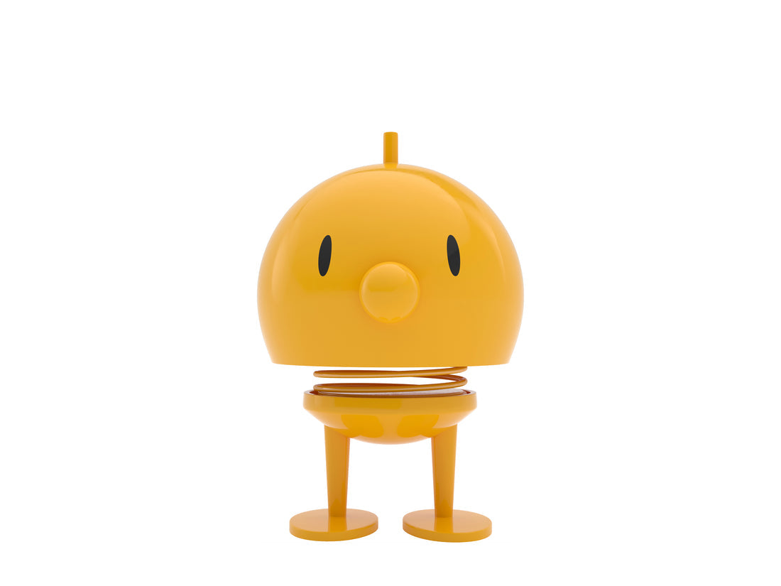 Yellow spring toy on a white background