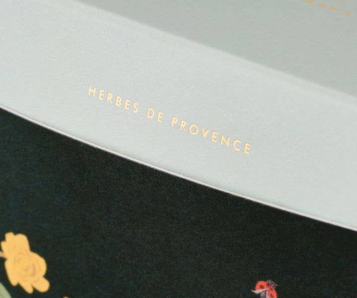Product packaging with &#39;HERBES DE PROVENCE&#39; text on a black and white background