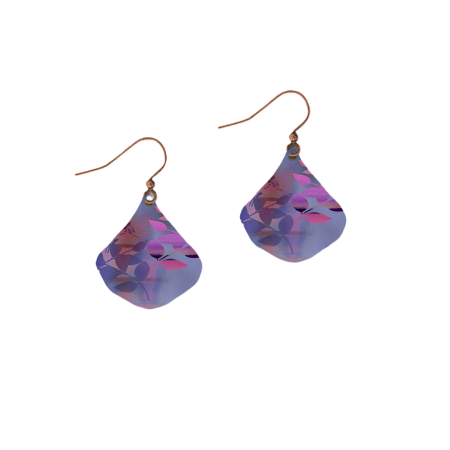 Pair of teardrop-shaped earrings with floral pattern on a gray background