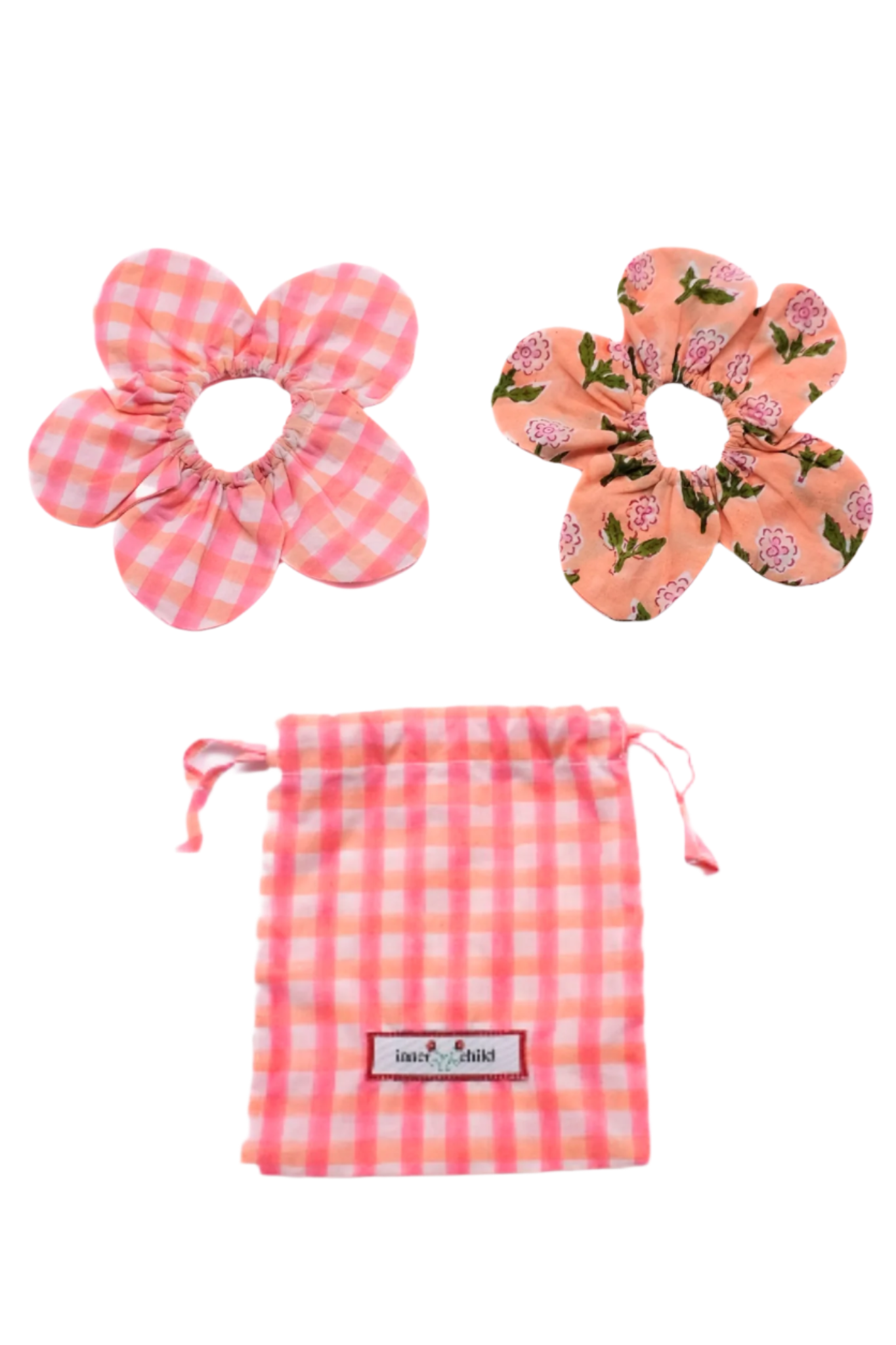 Set of two pink flower-shaped hair accessories with a matching drawstring bag on a white background.