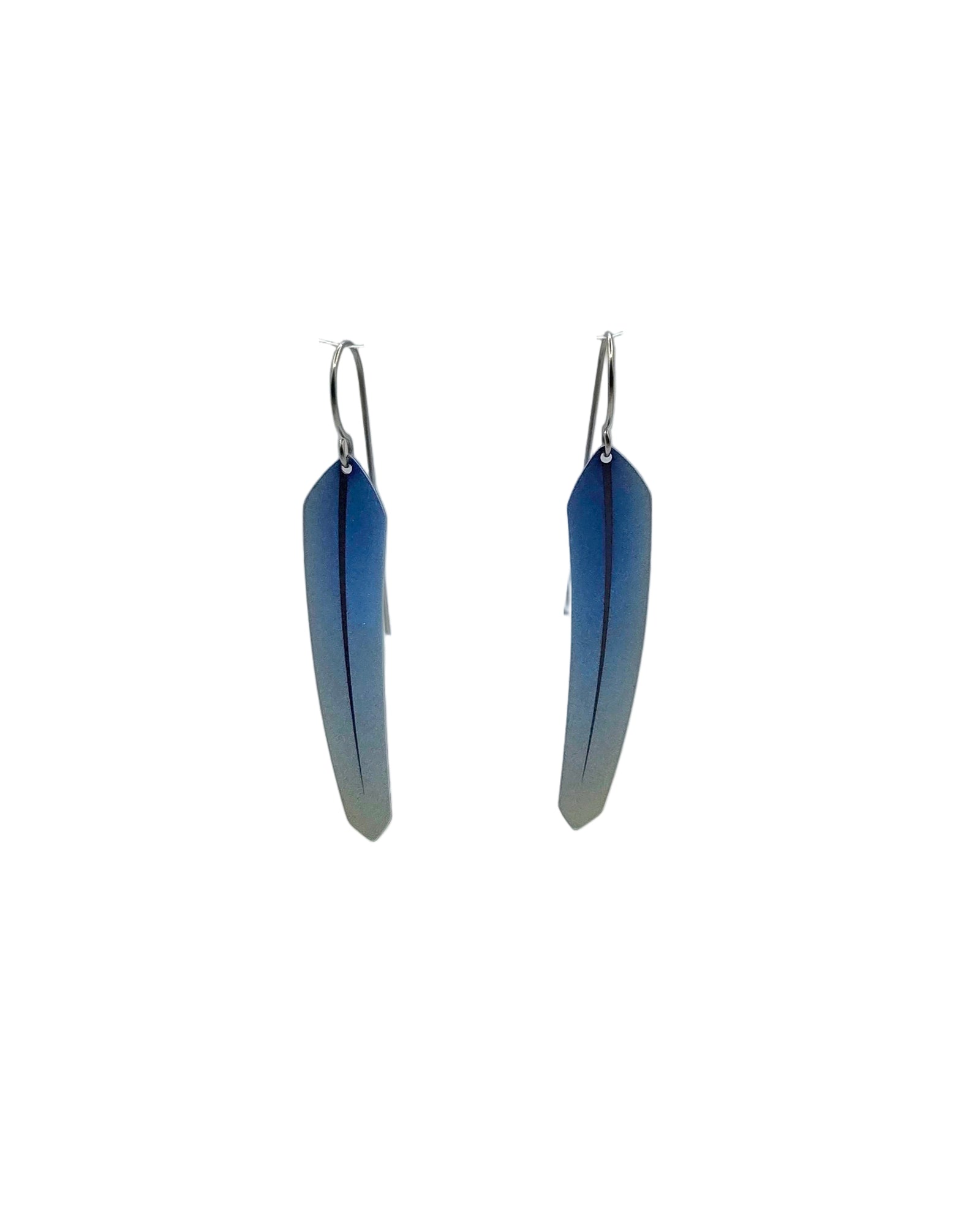 Pair of blue feather earrings on a white background