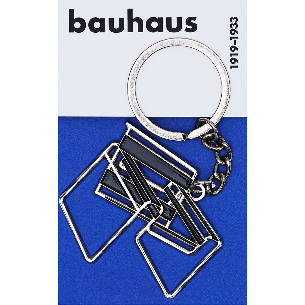 Keychain with geometric design on a blue and white background, featuring the &#39;bauhaus&#39; brand.