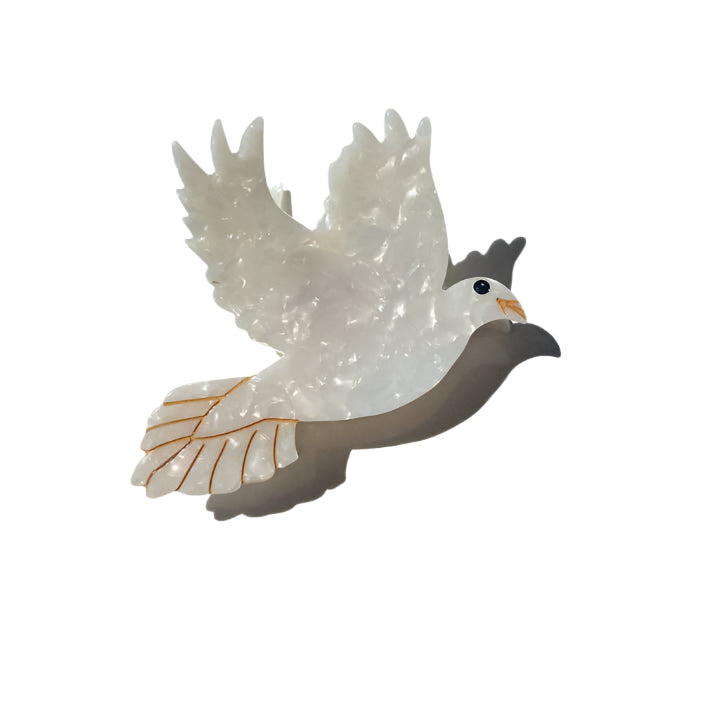 white peace dove hair clip on a white background