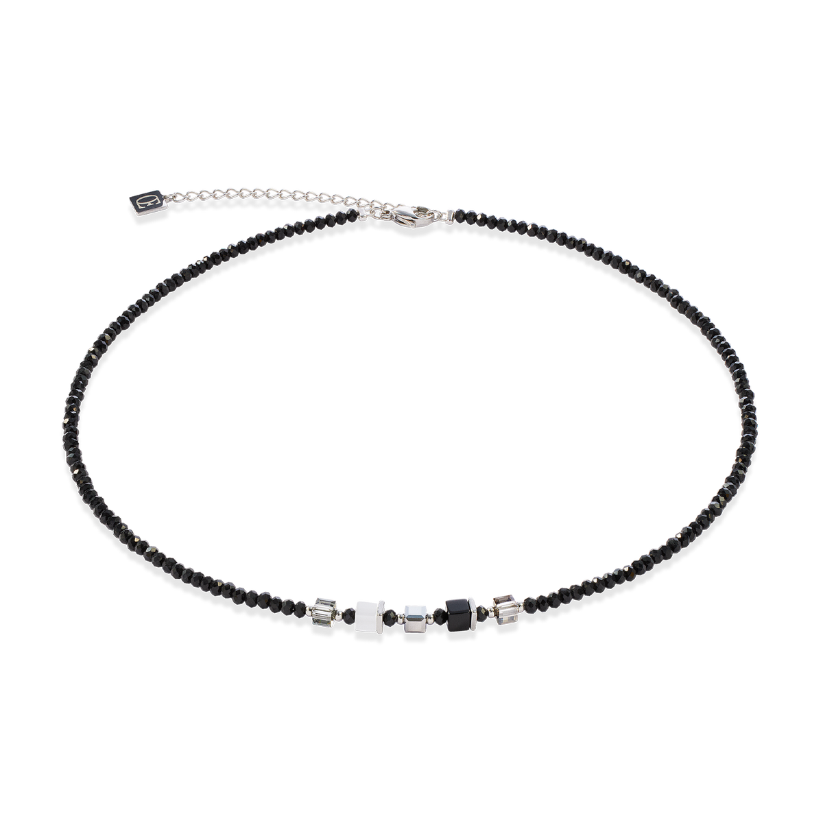 Necklace with black beads and silver clasp on a white background