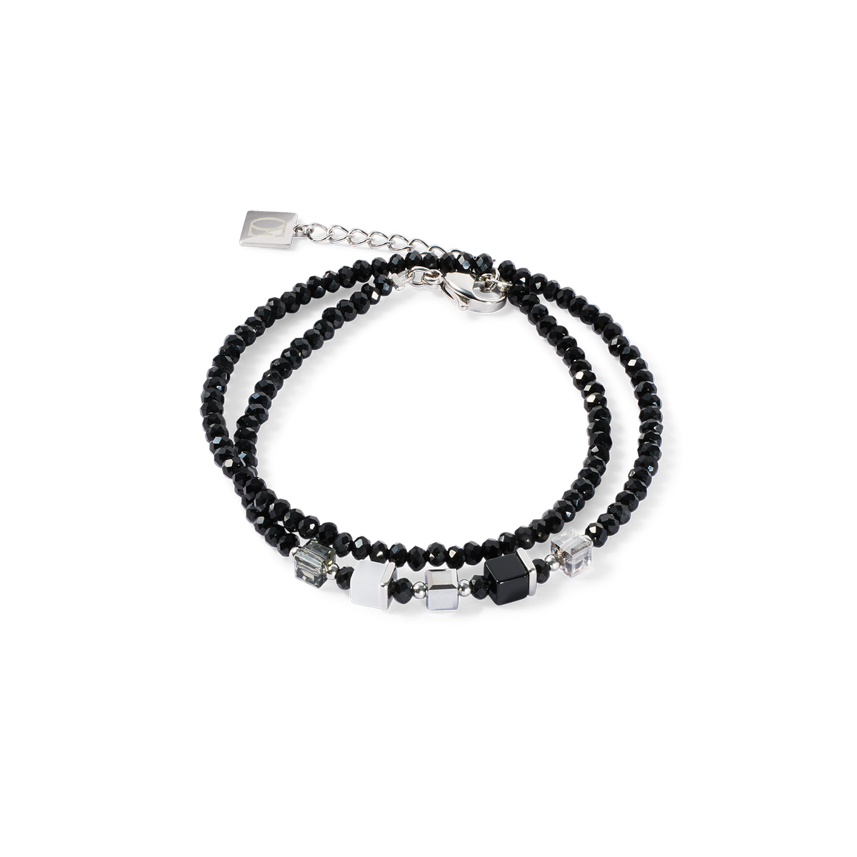 Black beaded bracelet with silver accents on a white background