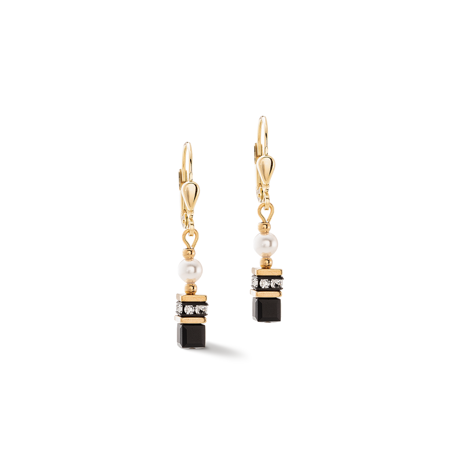 Gold earrings with black and white stones on a white background
