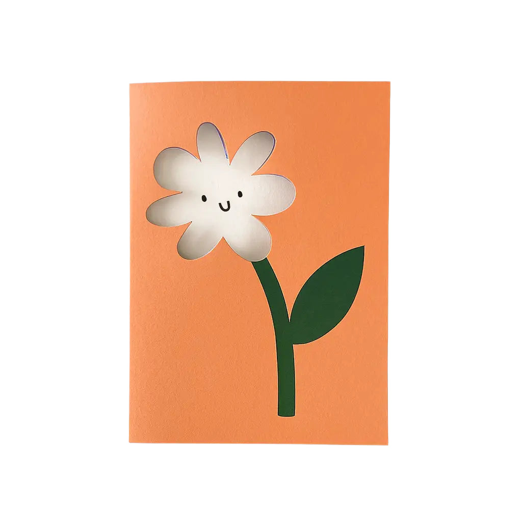 Notebook with a cartoon flower design on an orange cover