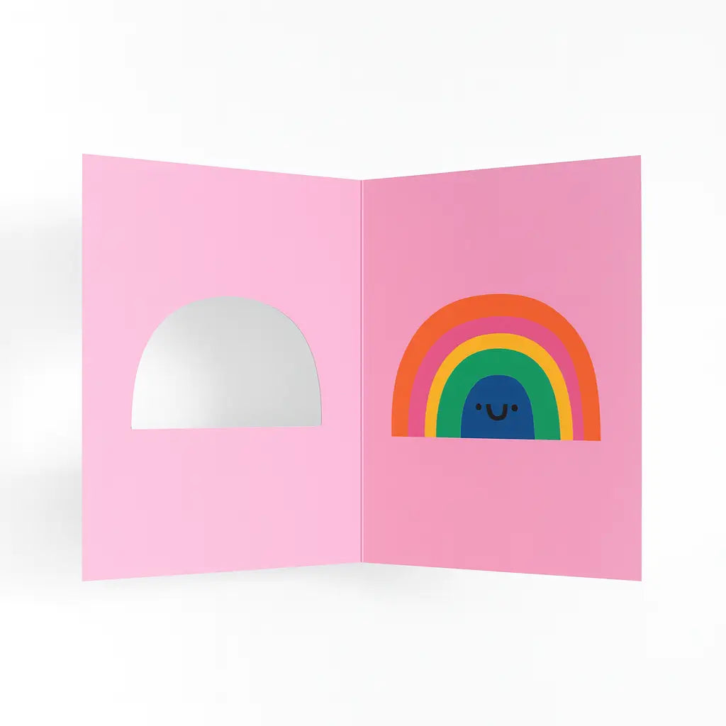 Pink card with a rainbow design on a white background