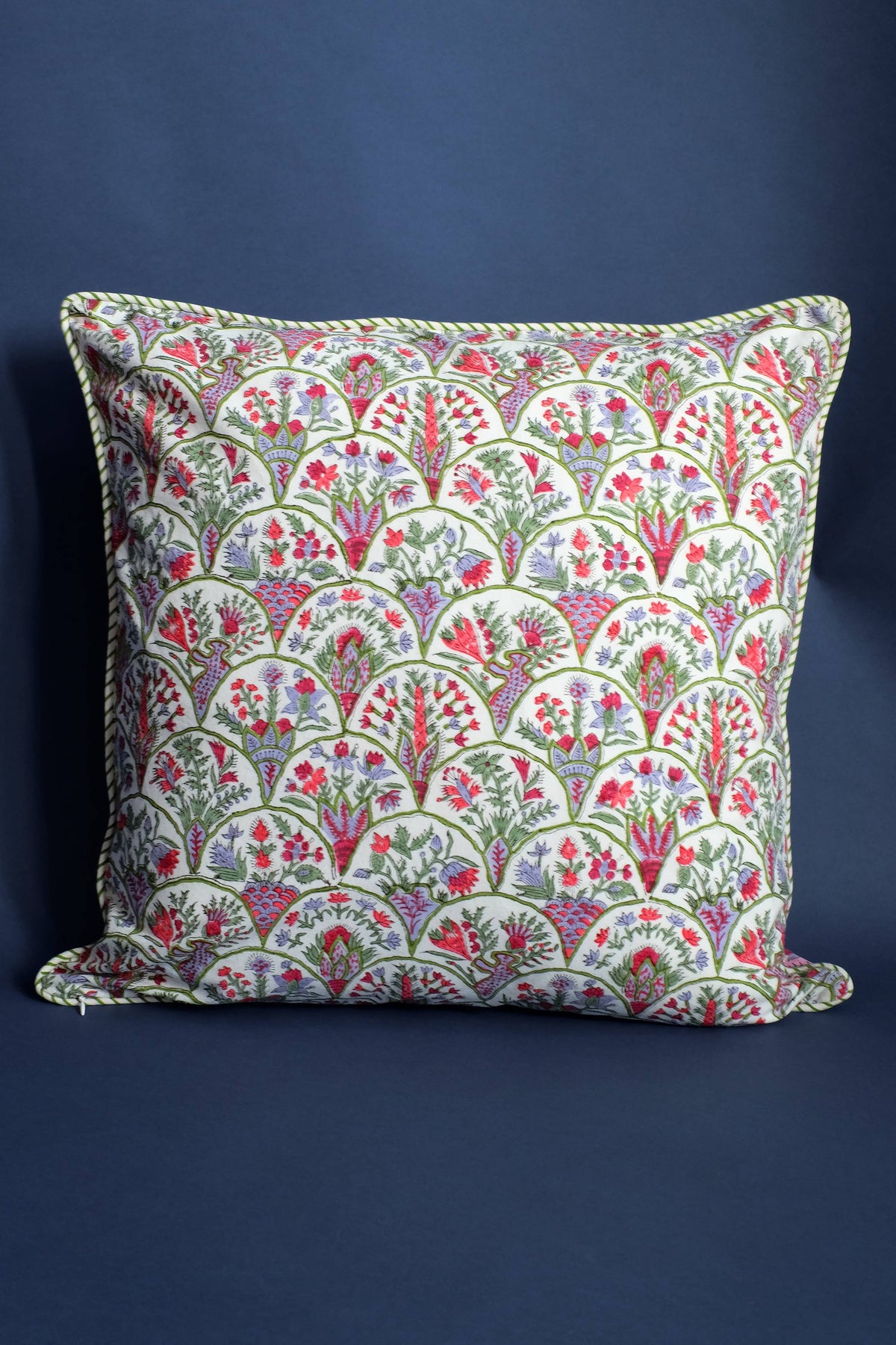 Decorative pillow with floral pattern on a blue background