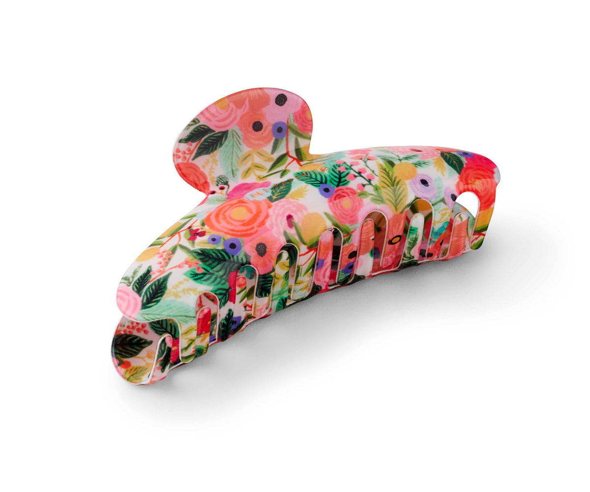 Pink floral-patterned hairclip on a white background