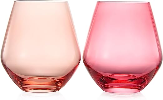 Two pink glass tumblers on a white background