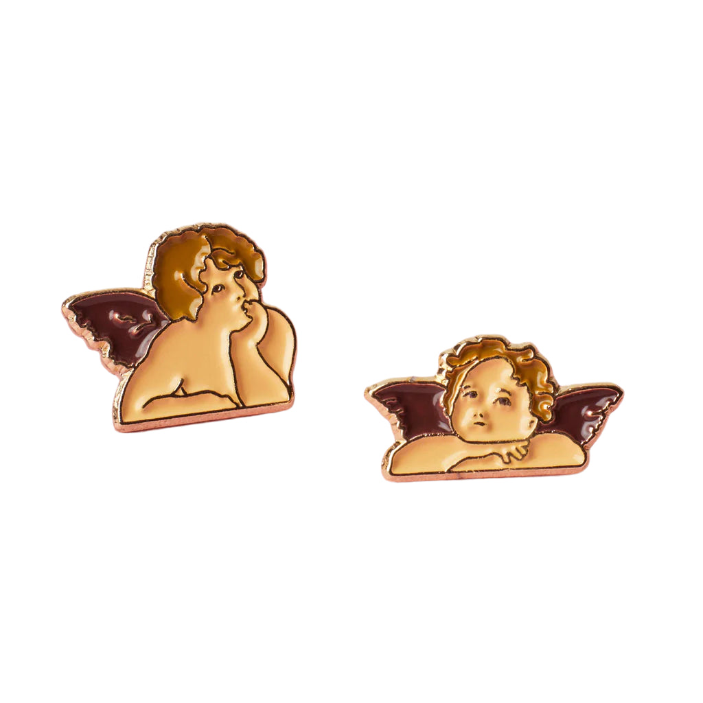Two angel pins on a white background