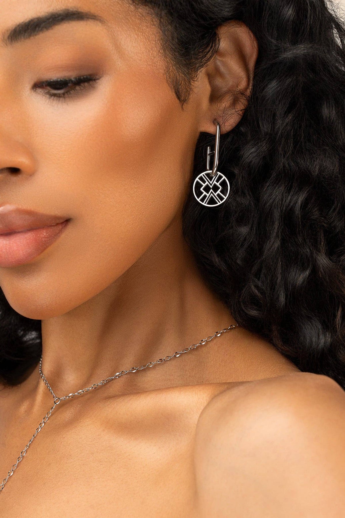 Emblem Huggie Hoop Earring - Silver