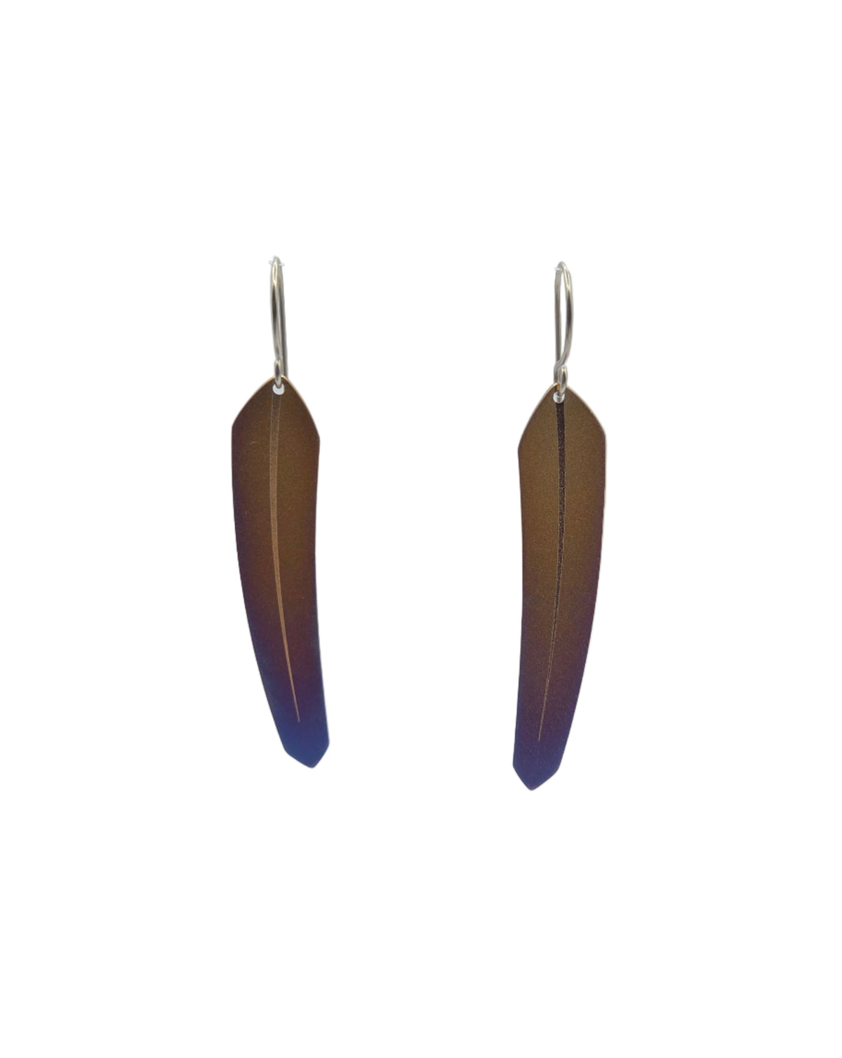 Pair of copper colored feather-shaped earrings on a white background