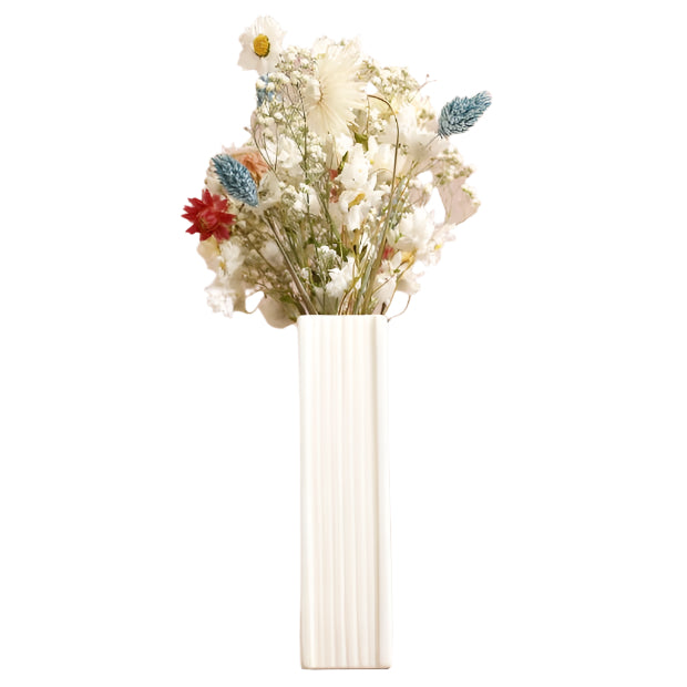 White vase with dried flowers