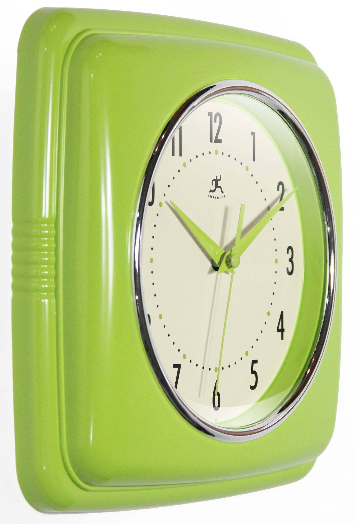 Green wall clock with a white face on a white background