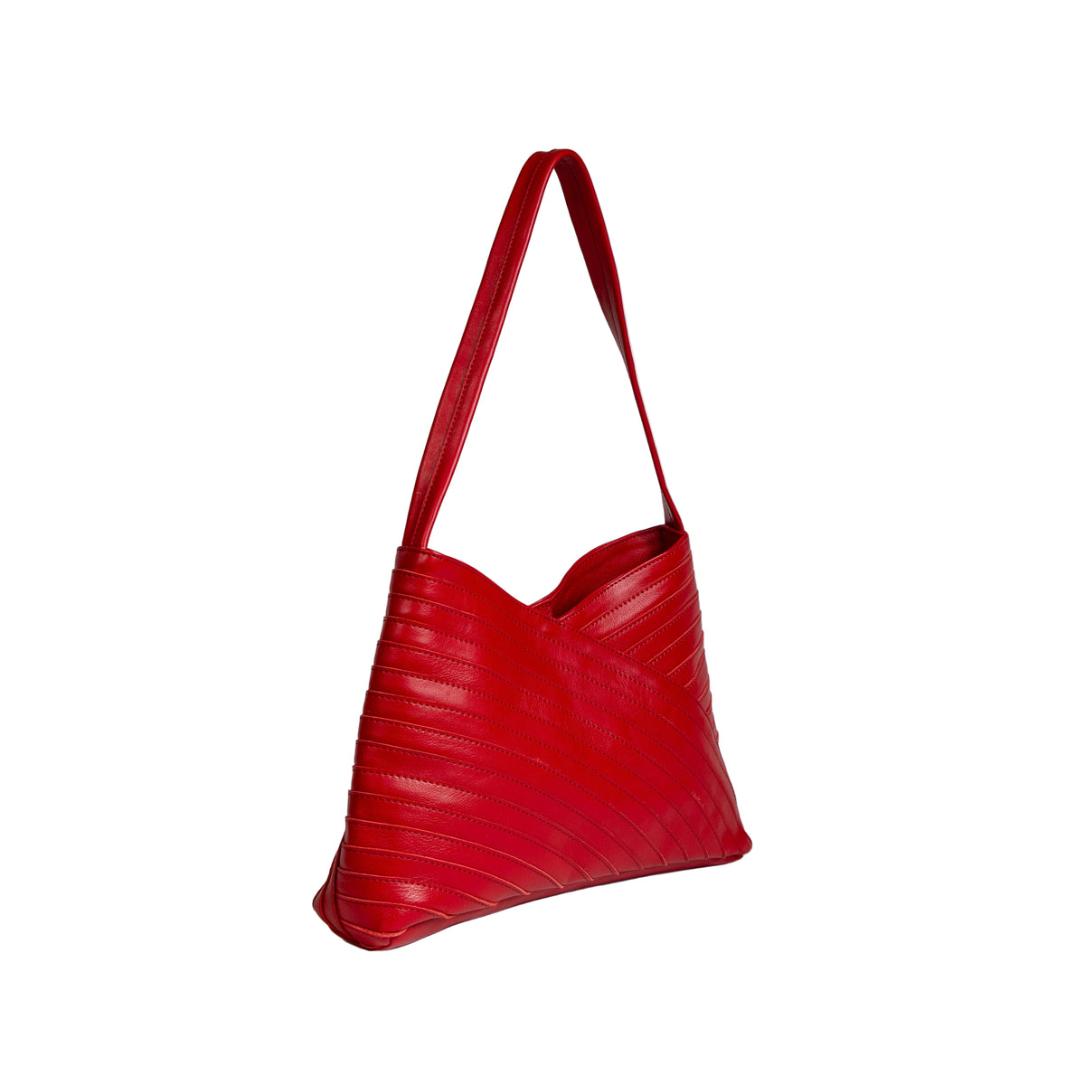 Red handbag with a textured surface on a light gray background