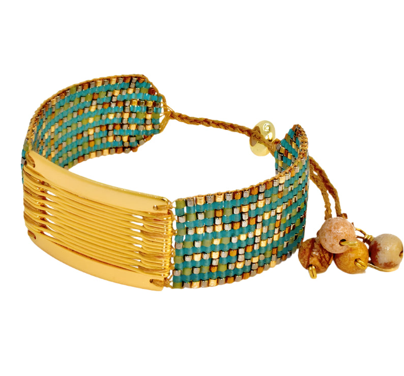 Gold and teal beaded bracelet with wooden beads on a white background