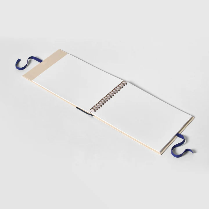 Metal spring with blue hooks on a white background