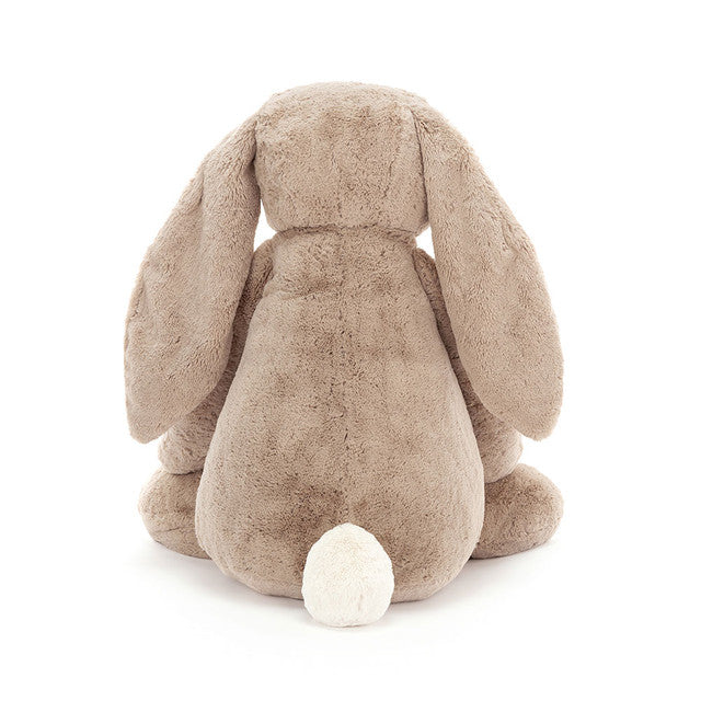 Back of plush bunny toy on a white background