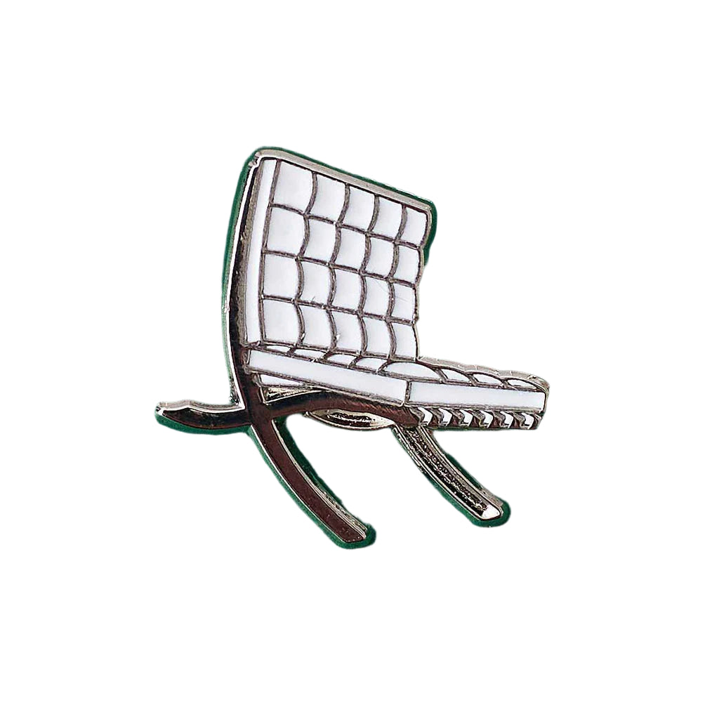 Chair-shaped pin on a white background