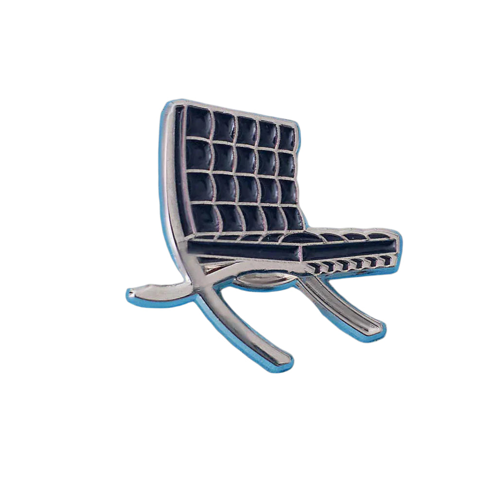 Metallic chair-shaped object on a white