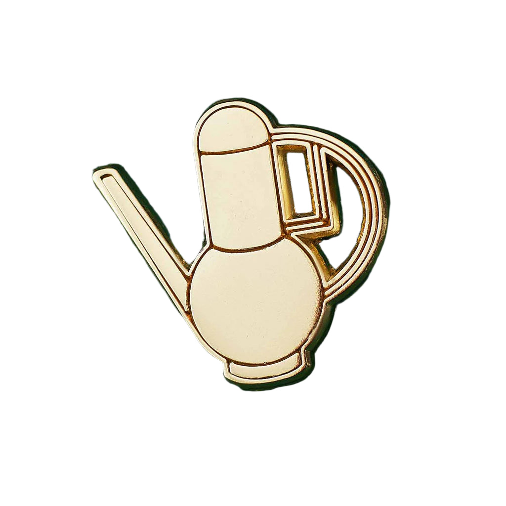 Metallic watering can-shaped pin on a white background