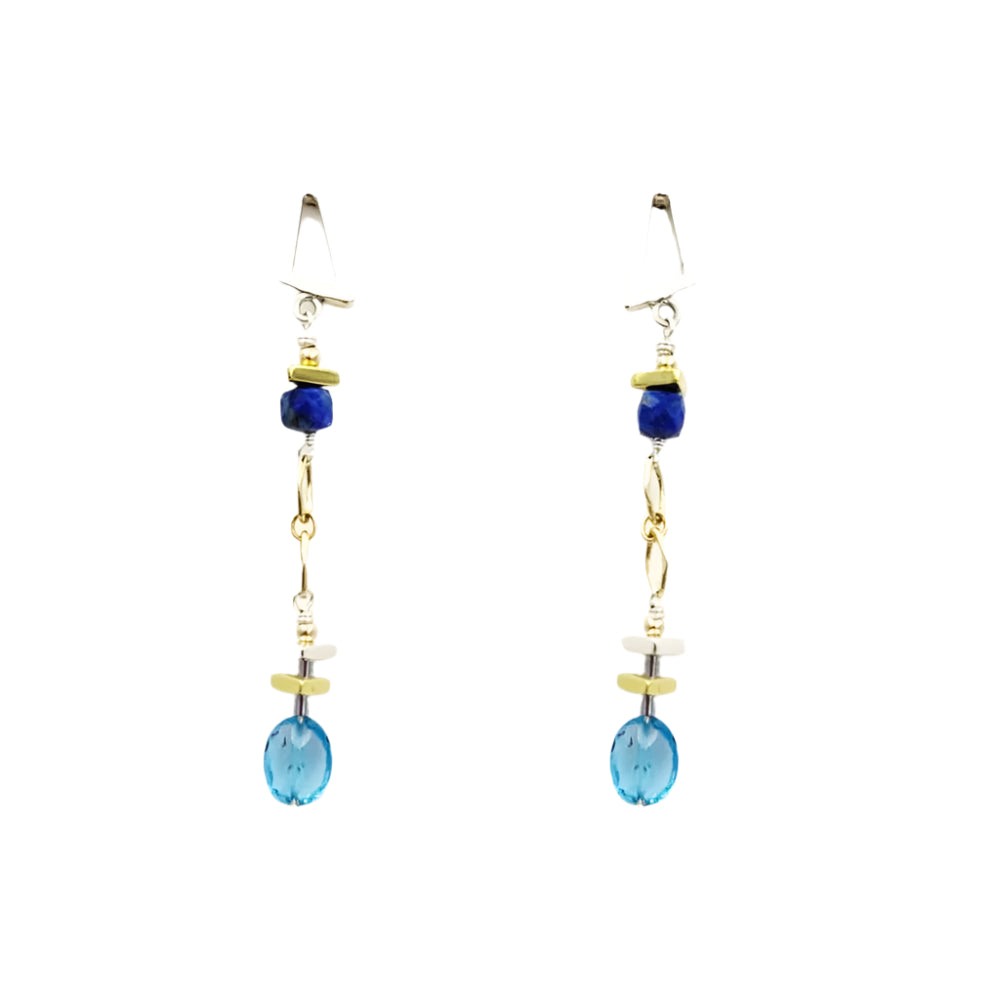 Pair of earrings with blue gems and gold accents on a white background