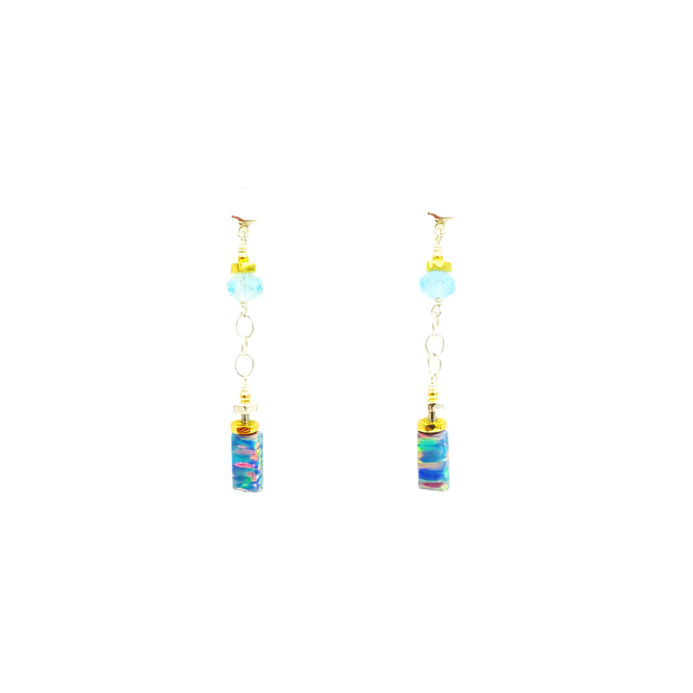 Pair of earrings with colorful stone on a white background