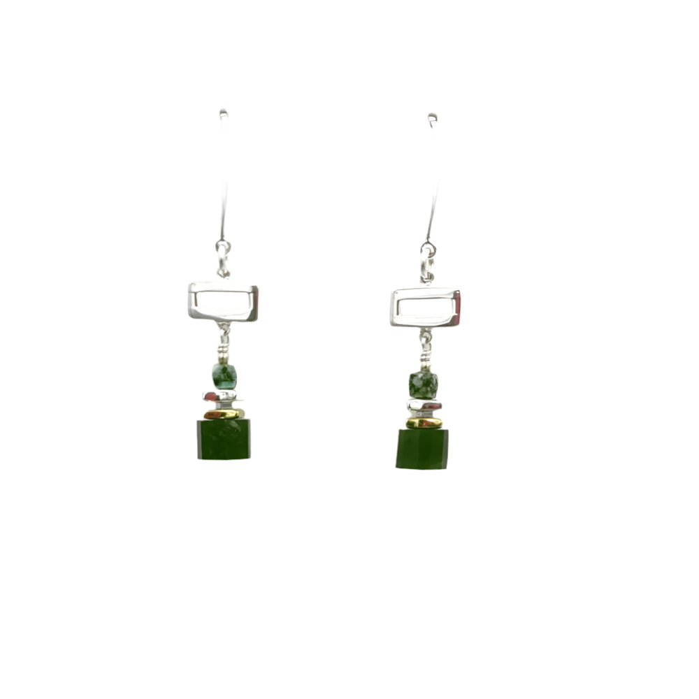 Pair of earrings with green gems s on a white background