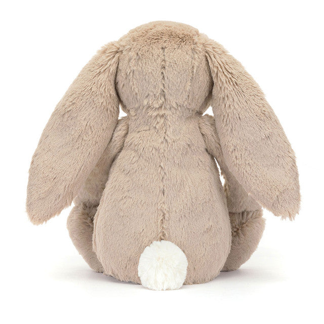 Back of Plush bunny toy on a white background
