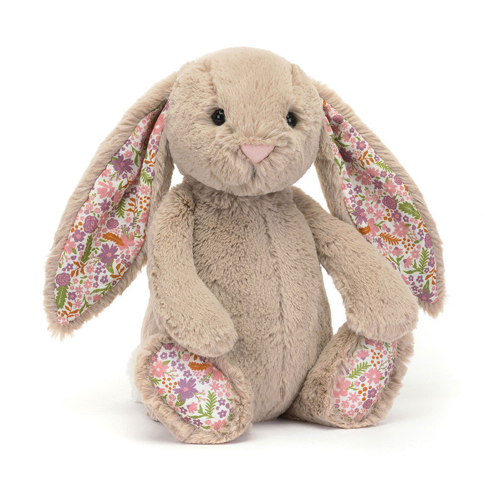 Plush bunny toy with floral ears and feet on a white background