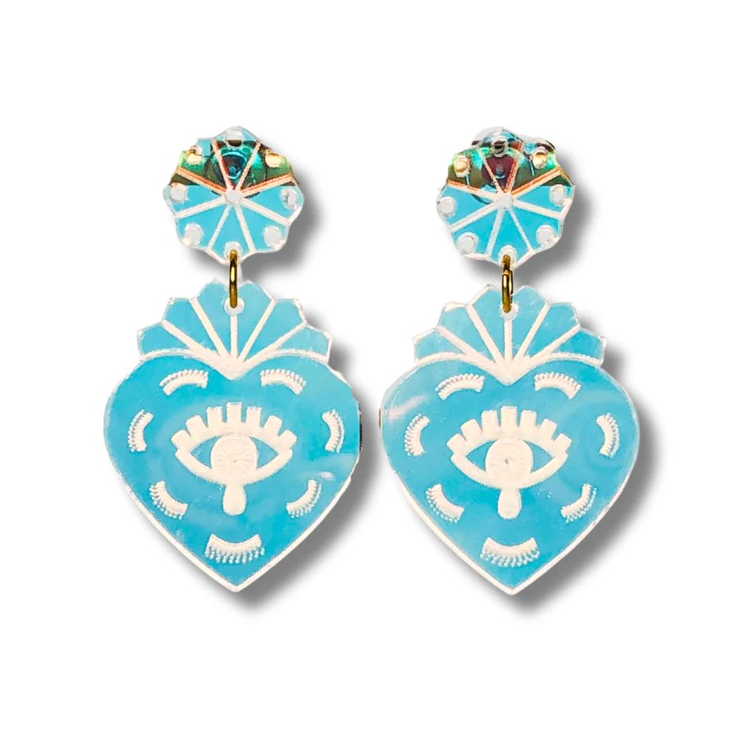 Clear heart-shaped earrings with eye design on a white background