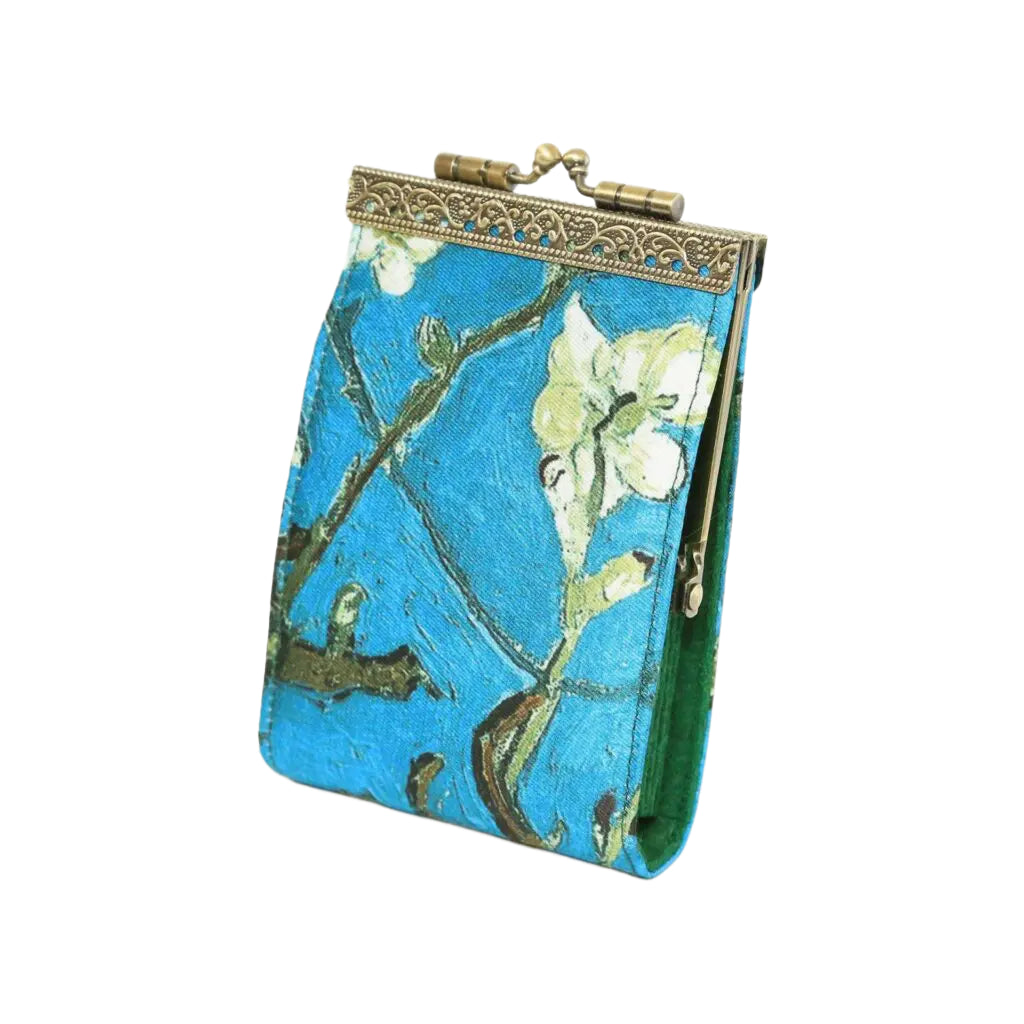 Small pouch with floral design and gold clasp on a white background