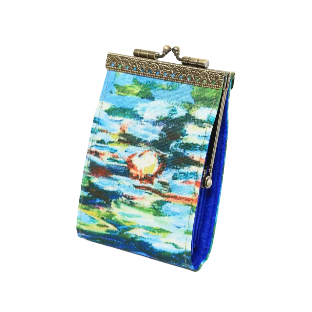 colorful monet inspired waterlilies on a pouch with gold hardware on a white background