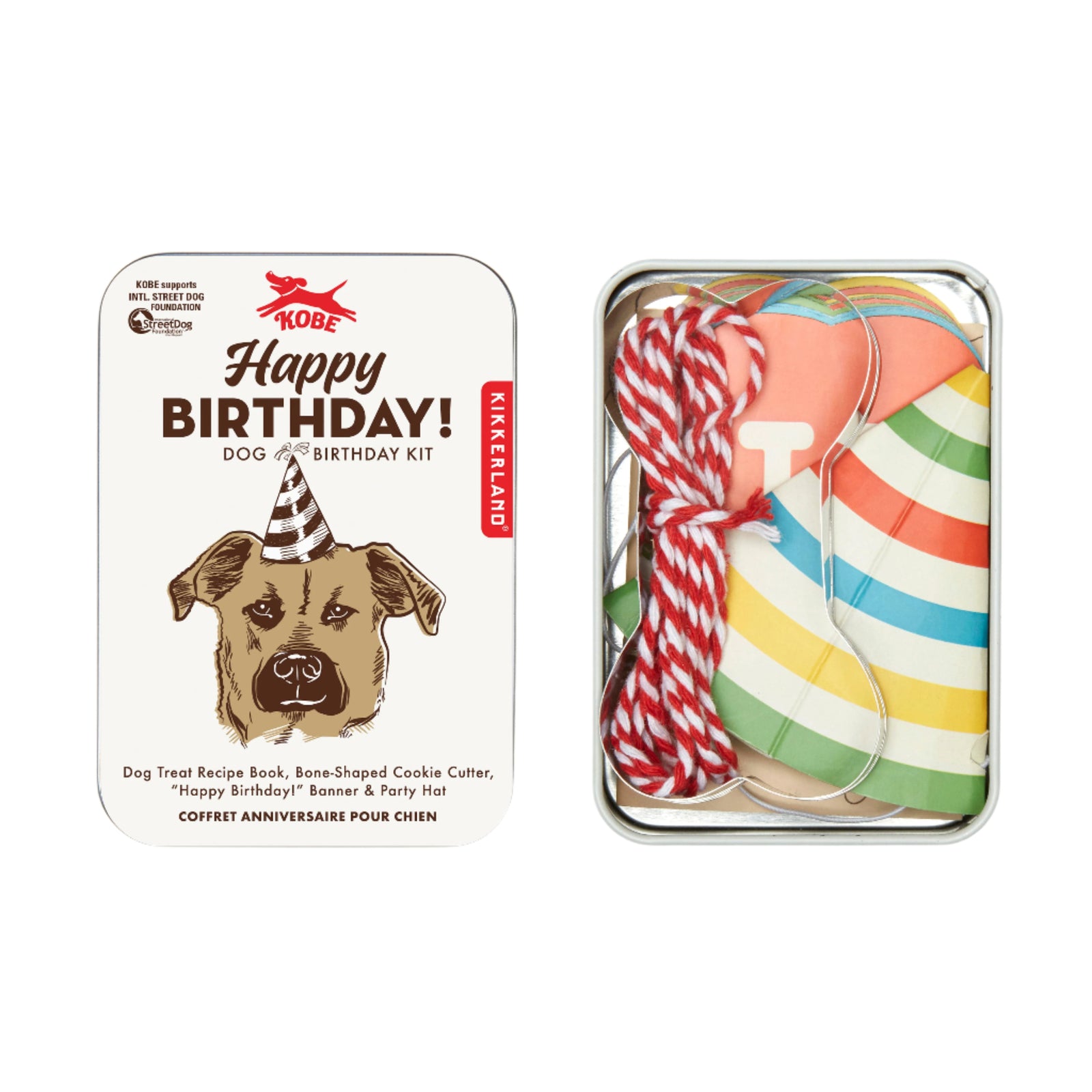 Dog birthday kit with treat book, bone-shaped cookie cutter, banner, and party hat in a tin box.