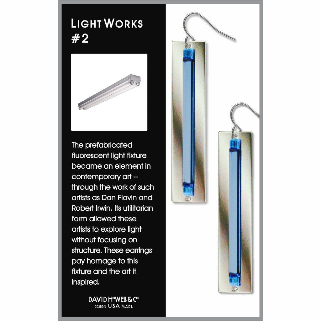 Earrings with blue and silver design on a card with text about light art and David Yurman branding.