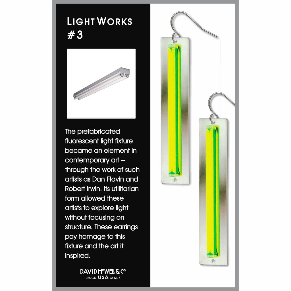 Yellow and green light fixture earrings on a card with text about art and design.