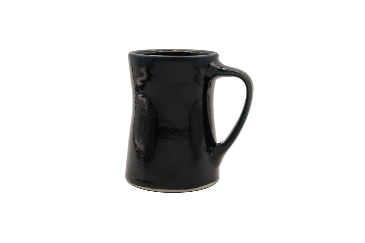 Black ceramic mug on a white background