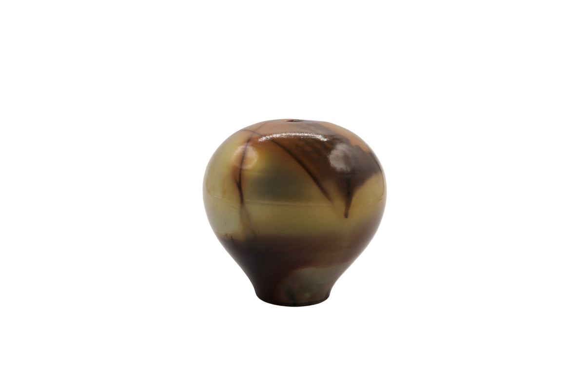 Marbled brown and beige egg shaped ceramic vase on a white background
