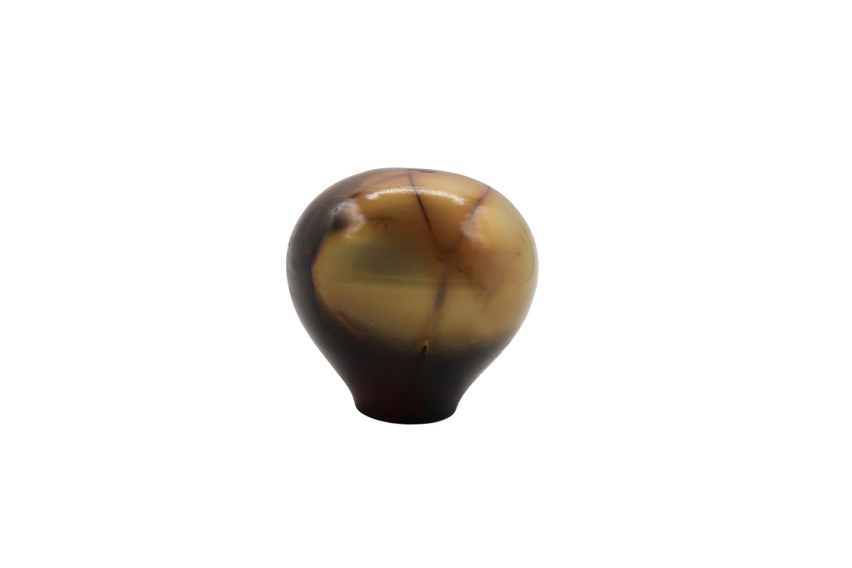 Marbled brown and beige egg shaped ceramic vase on a white background