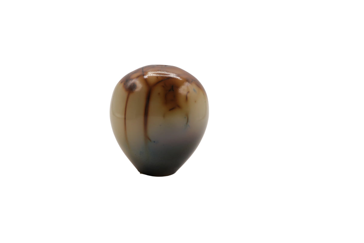 Marbled brown and beige egg shaped ceramic vase on a white background