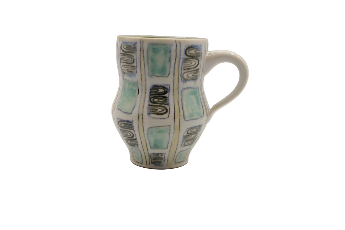 Ceramic mug with geometric pattern on a white background