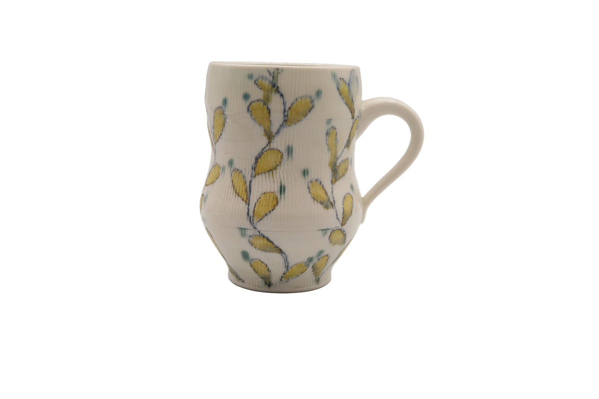 Ceramic mug with floral pattern on a white background