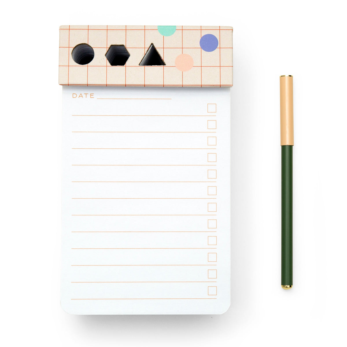 Notepad with geometric shapes on the cover and a green pen on a white background