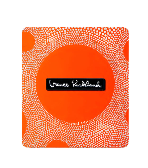 Orange and white patterned card with a black label on a gray background