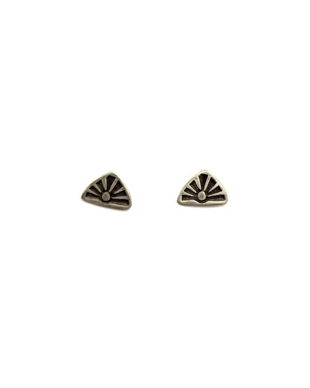 A pair of sterling silver post earrings featuring a stamped sun design, with an antique finish.