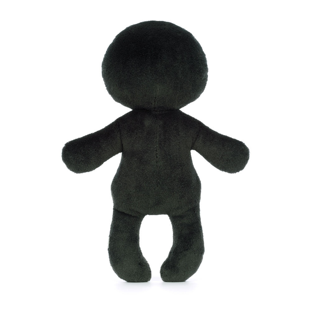 Black plush toy figure on a white background