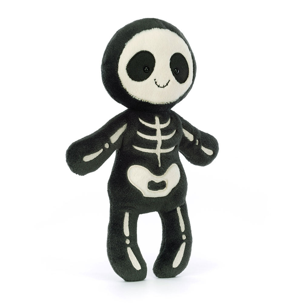 Plush toy skeleton with black and white color scheme on a white background